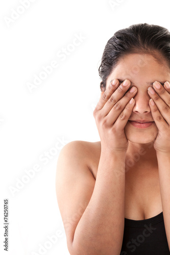 Indian Young girl closing eyes with hands