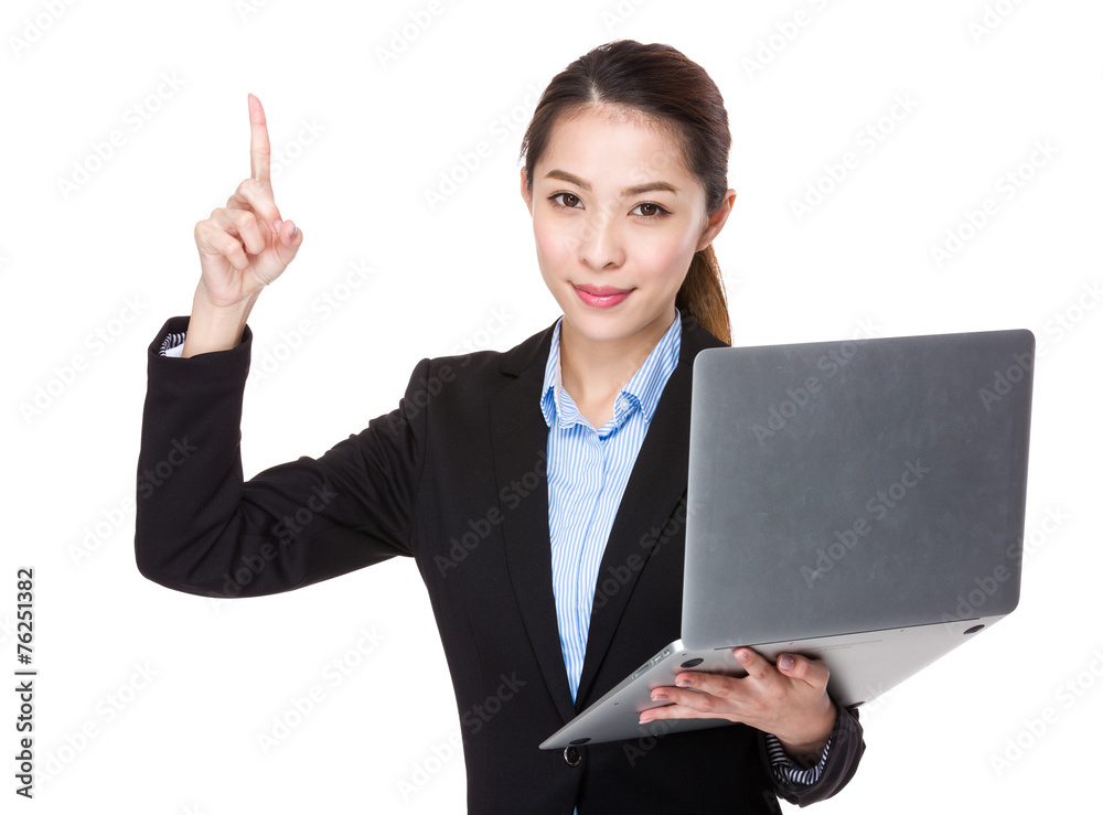 Businesswoman hold with laptop and finger point up Businesswoman hold with laptop and finger point up