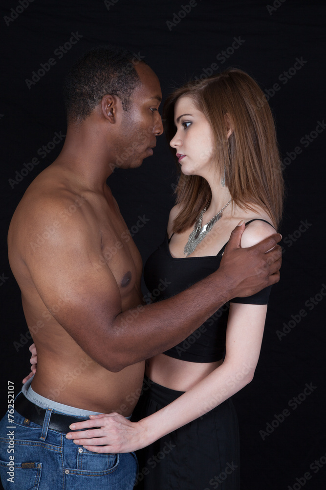 Mixed racial couple in a thoughtful, romantic attitude Mixed racial couple in a thoughtful, romantic attitude