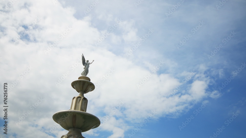 Angel Statues with clouds running background. Angel Statues with clouds running background.