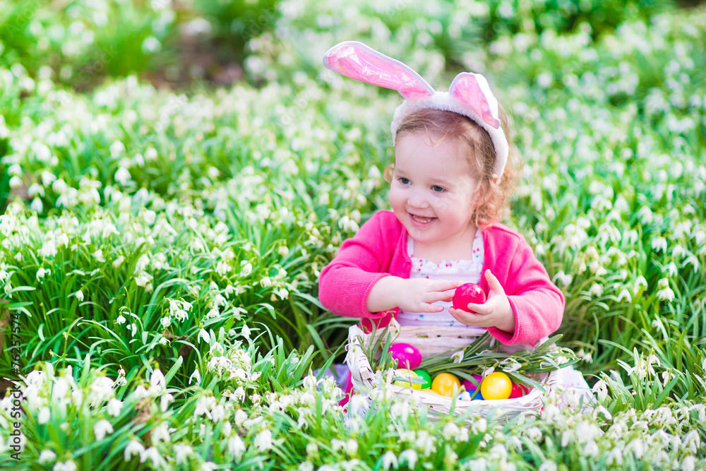 Pretty little girl on Easter egg hunt Pretty little girl on Easter egg hunt
