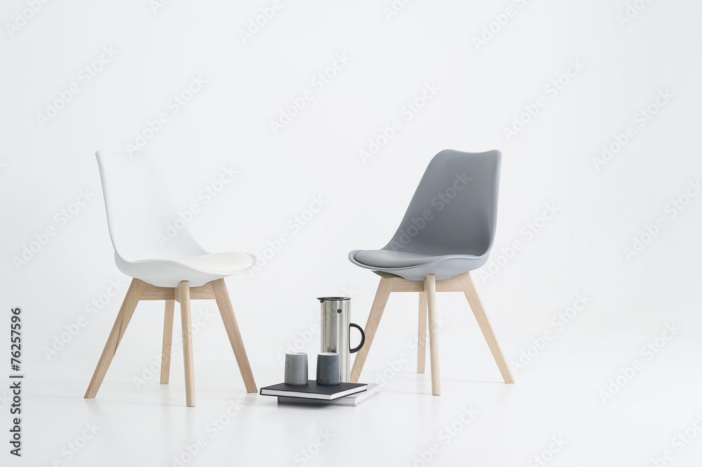 Two modern chairs with a serving of coffee Two modern chairs with a serving of coffee