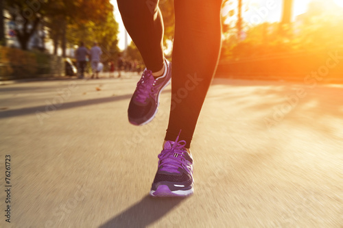 Fitness Girl running at sunset