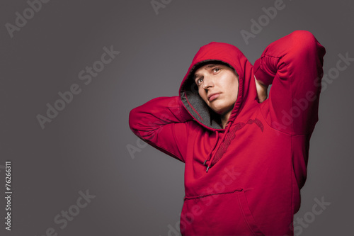 Portrait of Masculine Strong Tanned Caucasian Man in Red Hoody J