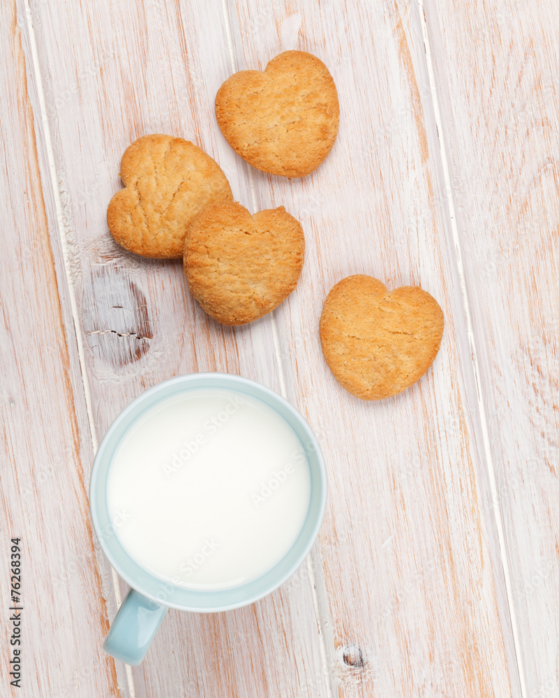 Cup of milk and heart shaped cookies Cup of milk and heart shaped cookies