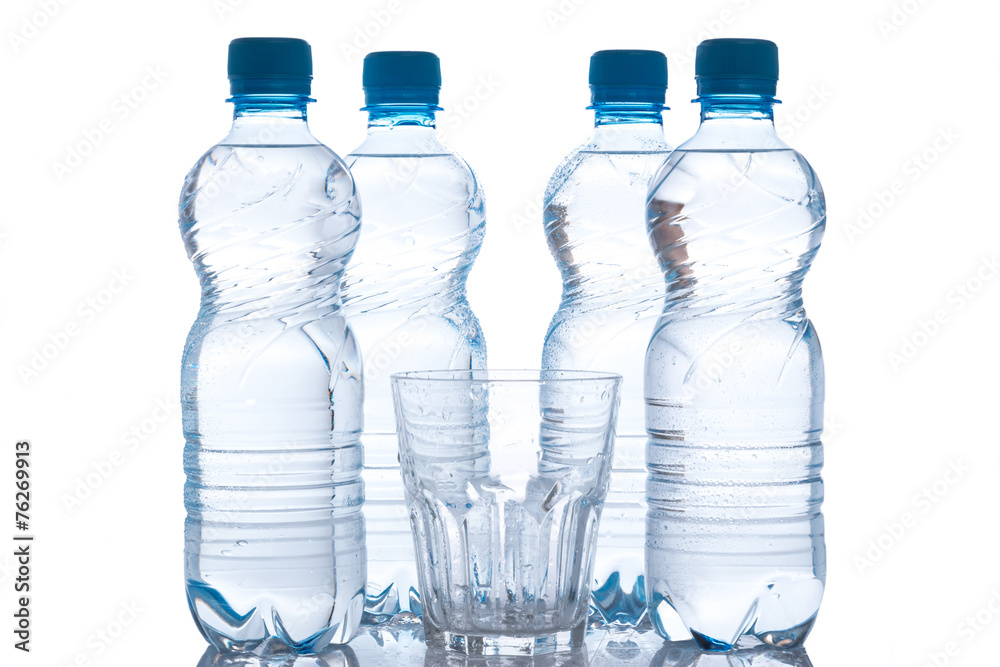 Glass and bottles with fresh water