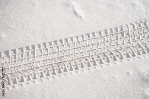 Fresh snow sedan tire track photo