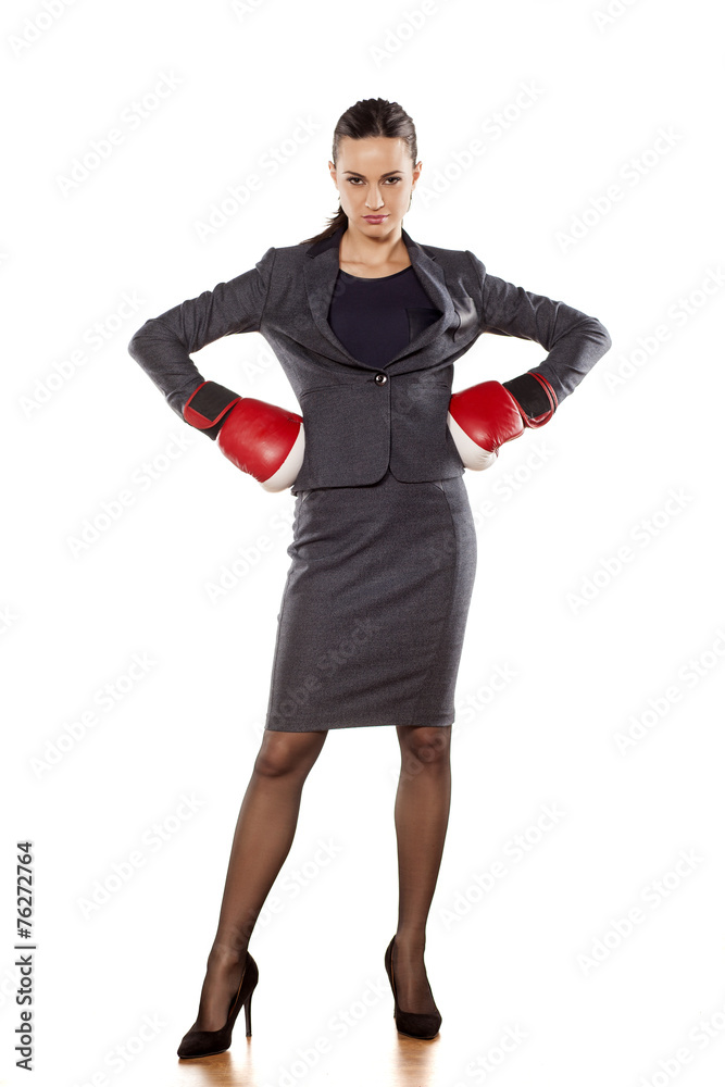 Fototapeta premium angry business woman with boxing gloves on a white background