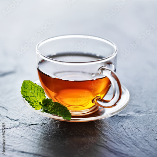 glass of hot tea with mint garnish