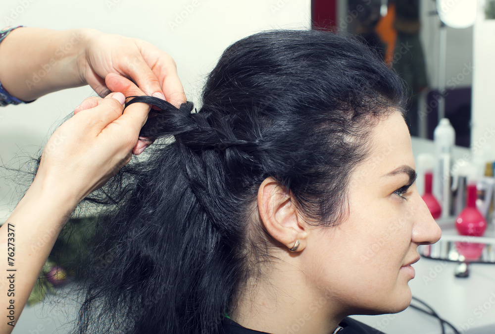 Fototapeta premium woman in a beauty salon doing hair
