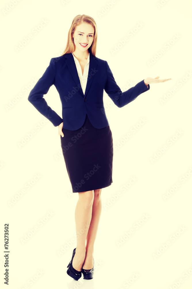 Business woman showing copy space on palm. Business woman showing copy space on palm.
