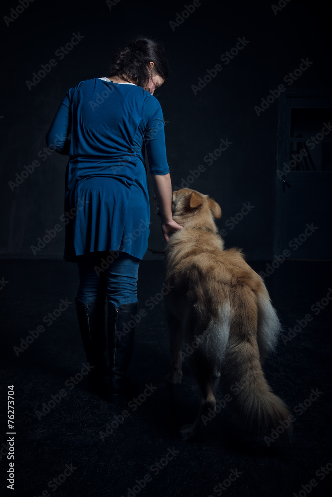 pretty lady and her lovely dog - studio shots on black