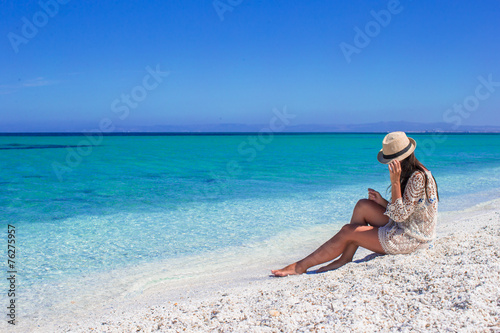 Happy woman enjoying beach tropical vacation