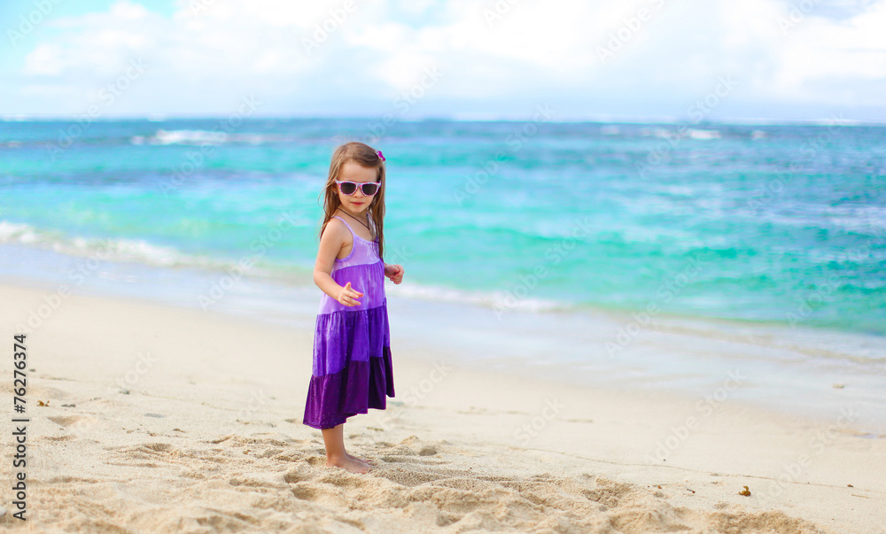 Adorable little girl having fun during tropical vacation Adorable little girl having fun during tropical vacation