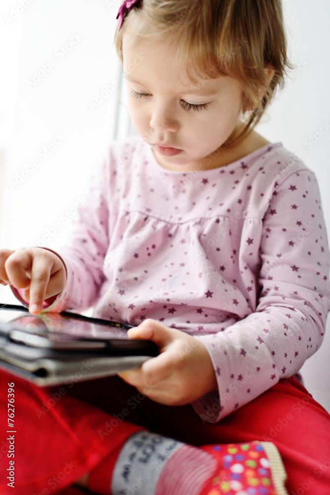 girl using tablet pc girl using tablet pc