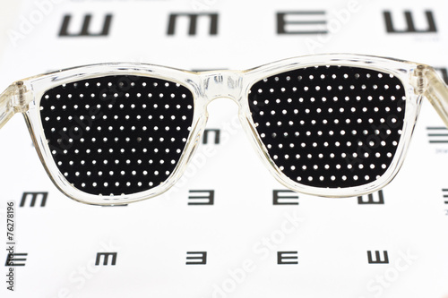 Pinhole glasses on an children eye chart photo