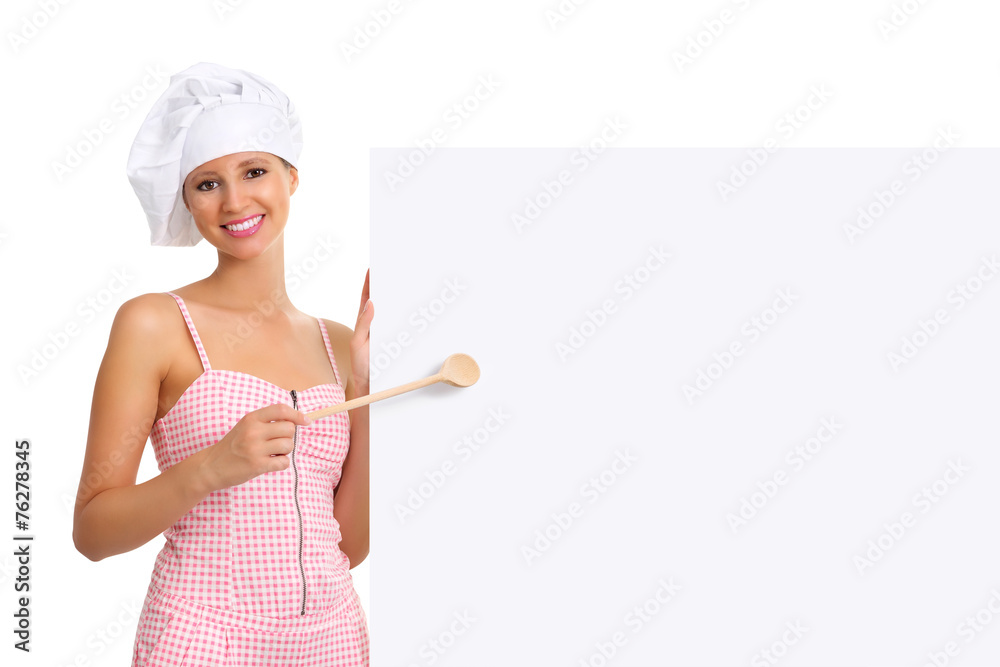chef woman pointing with a wooden spoon on the white billboard chef woman pointing with a wooden spoon on the white billboard