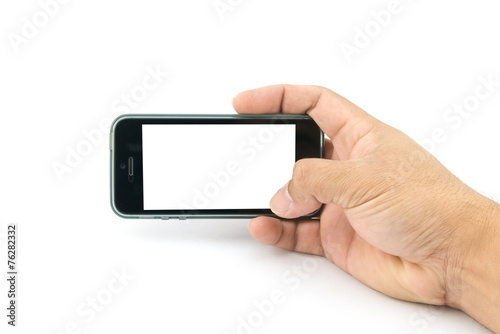 Hand holding smartphone with blank screen on white background