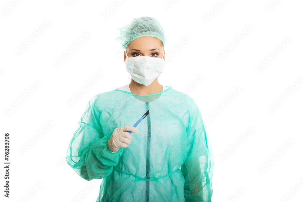 Portrait of female doctor with a scalpel Portrait of female doctor with a scalpel