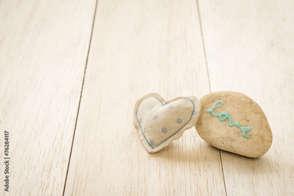 Sweet heart craft and glitter love word on pebble Sweet heart craft and glitter love word on pebble