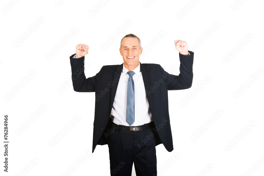 Portrait of successful businessman with arms up Portrait of successful businessman with arms up