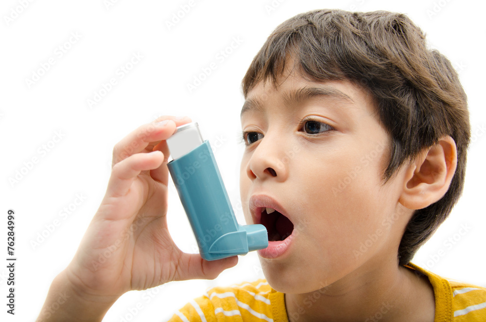 Little boy using Asthma inhaler for breathing on white backgroun Little boy using Asthma inhaler for breathing on white backgroun