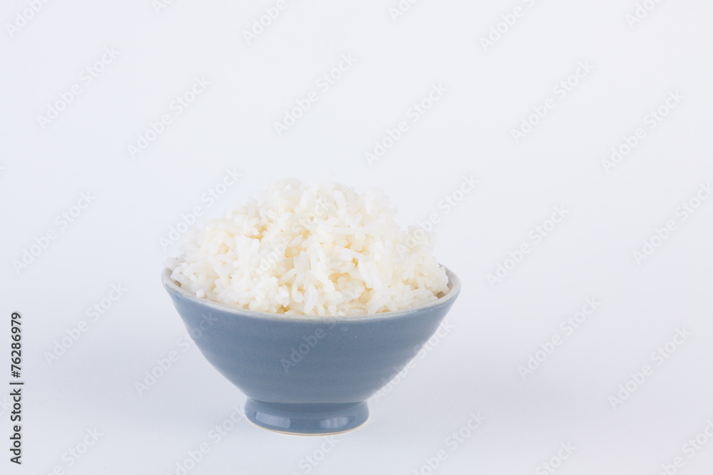 Bowl full of rice on white paper background Bowl full of rice on white paper background