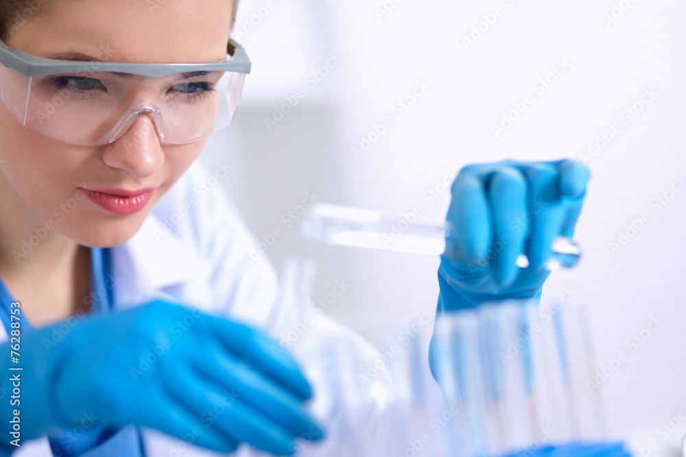 Woman researcher is surrounded by medical vials and flasks, Woman researcher is surrounded by medical vials and flasks,