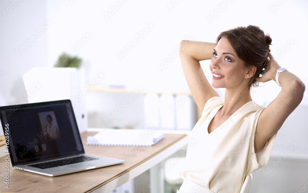 Business woman relaxing with hands behind her head and sitting Business woman relaxing with hands behind her head and sitting