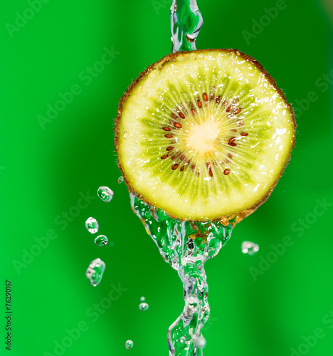 Kiwi in water on a green background