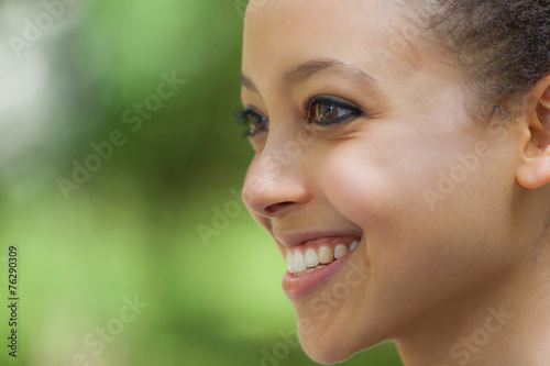 Beautiful Mixed-Race Young Woman at Park  Smiling Portrait