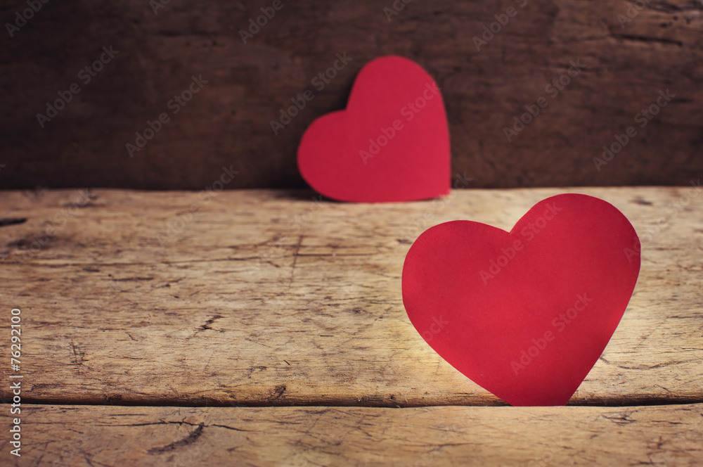 Valentine's Day red hearts on wooden table Valentine's Day red hearts on wooden table