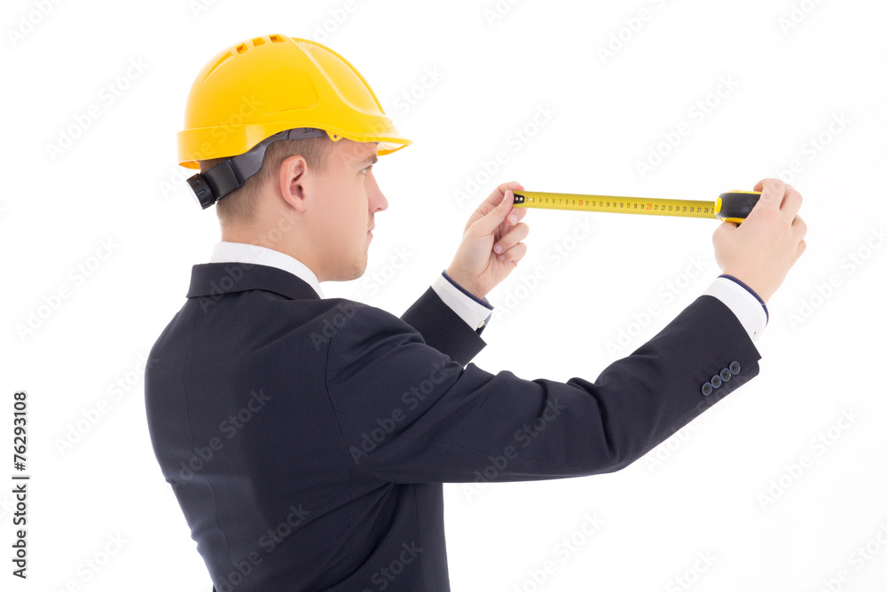 back view of business man or architect in yellow builder's helme back view of business man or architect in yellow builder's helme