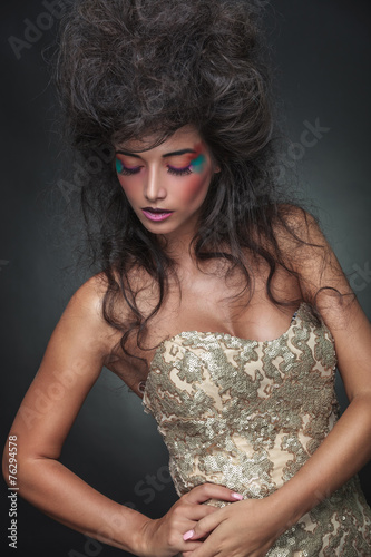 Beautiful woman posing whle looking down.
