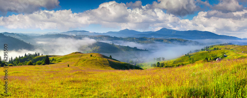 Colorful summer morning in the Carpathian mountain village.