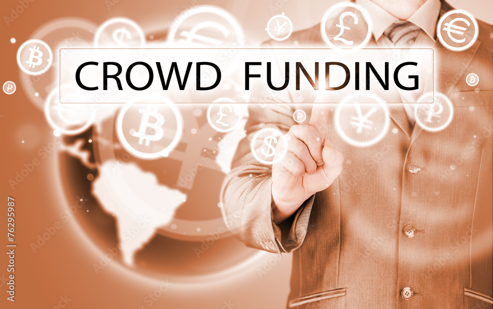 Businessman pushes virtual crowd funding button Businessman pushes virtual crowd funding button