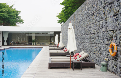 swimming pool with rock wall photo