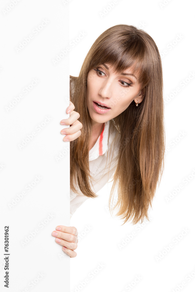 Young excited woman holding advertising white board
