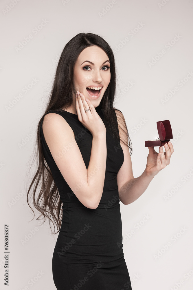 Surpriced woman holding jewelry box Surpriced woman holding jewelry box