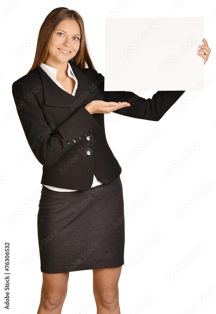 Business woman holding in hand a blank sheet of white cardboard Business woman holding in hand a blank sheet of white cardboard