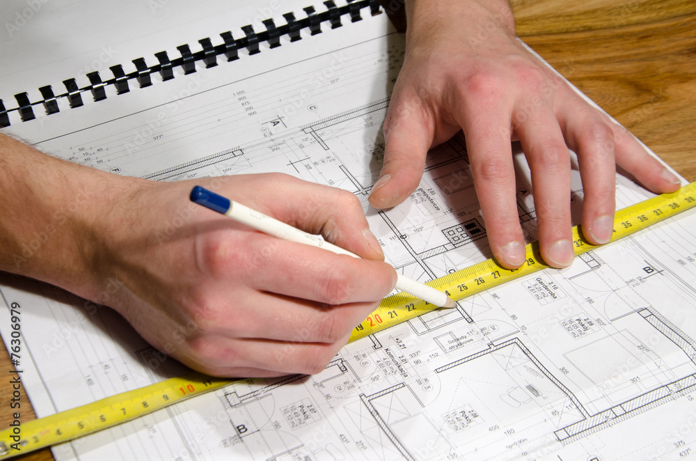 Designing a building with pencil and paper Designing a building with pencil and paper