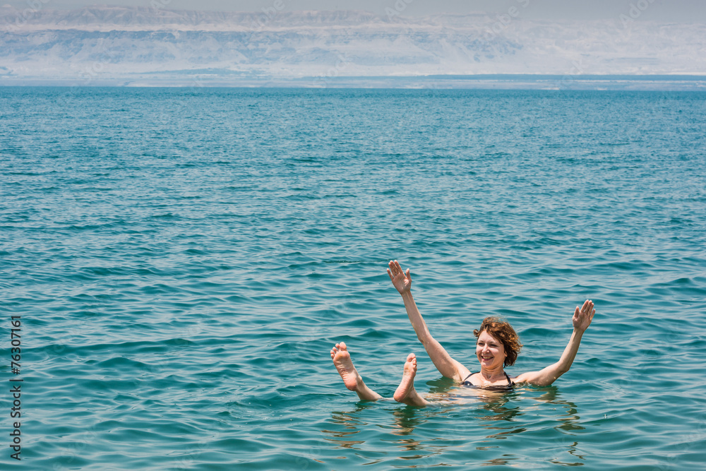 one woman swimming bathing in Dead Sea Jordan