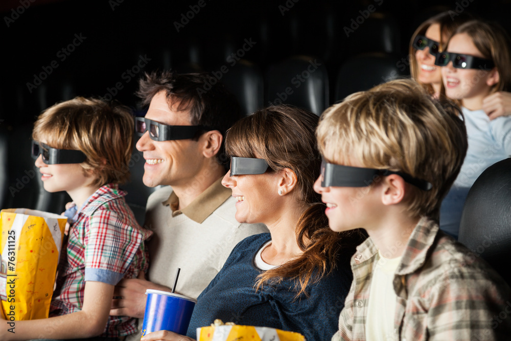 Obraz premium Happy Families Watching 3D Movie In Theater