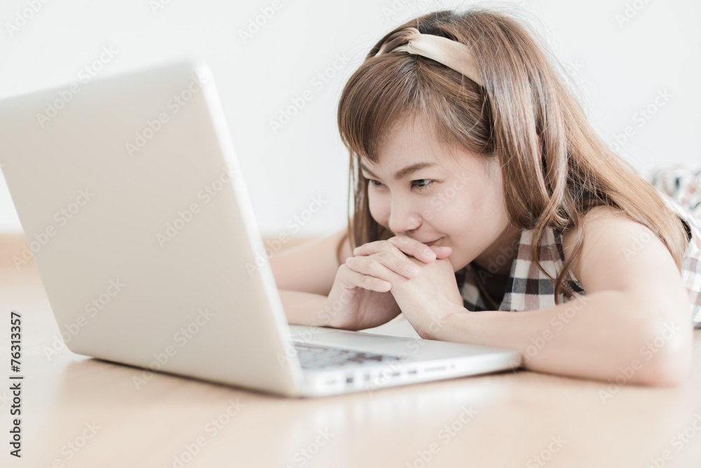 Asian woman using laptop at home Asian woman using laptop at home