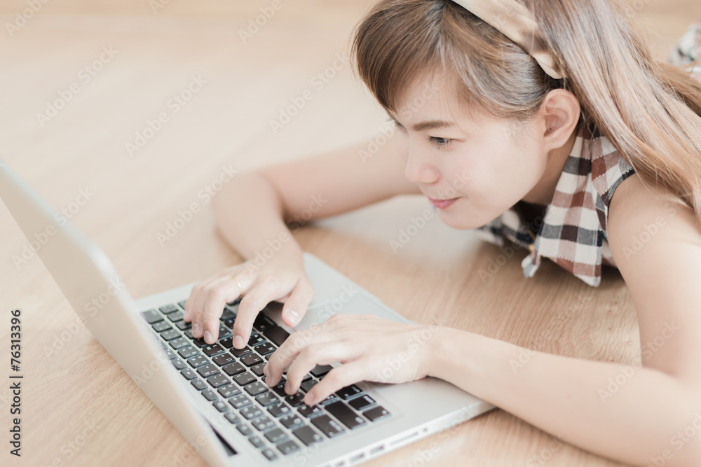 Asian woman using laptop at home Asian woman using laptop at home
