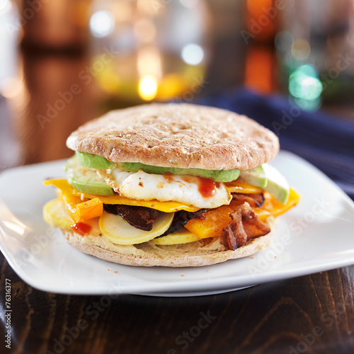 healthy breakfast sandwich with egg, bacon, avocado