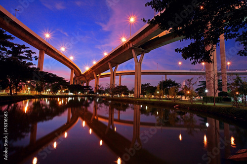 Bhumibol Bridge with skyline reflection at twilight in Bangkok
