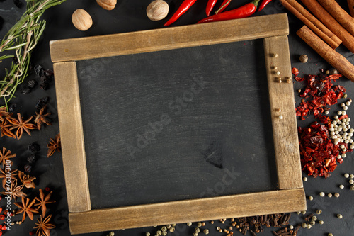 Herbs and spices with chalk board for text or recipes.