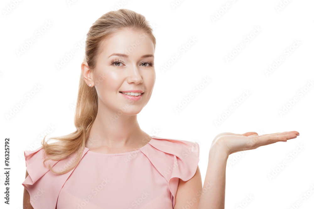 Beautiful woman with perfect skin and face showing something on Beautiful woman with perfect skin and face showing something on