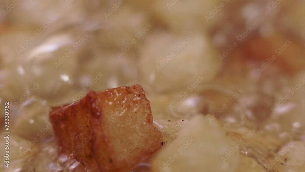 Potatoes Browning Being Fried in Oil Potatoes Browning Being Fried in Oil
